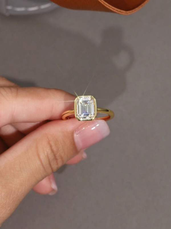 Simple, Elegant 2ct Emerald Cut Moissanite Ring - Image 9